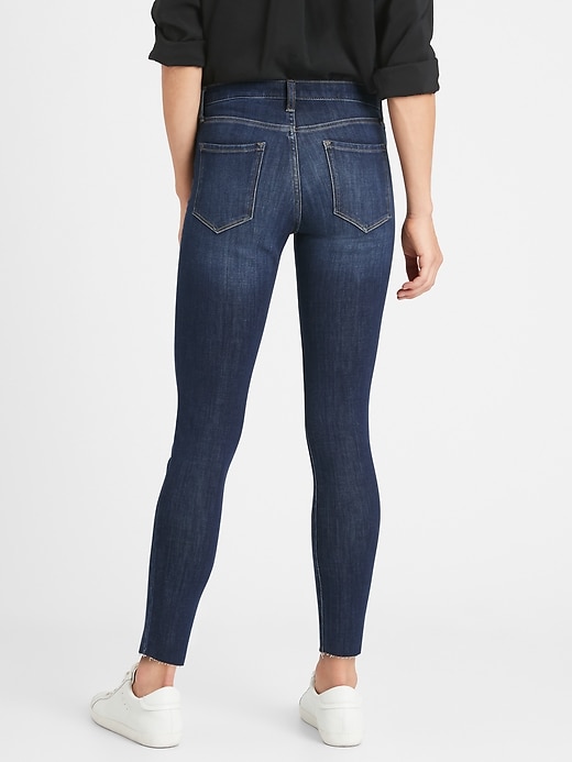Image number 2 showing, Petite Mid-Rise Skinny Ankle Jean with Raw Hem