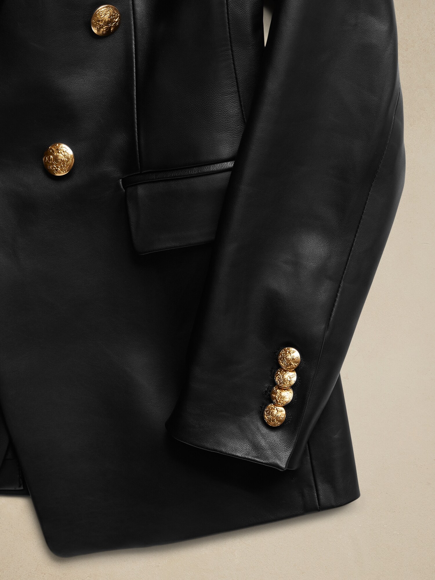 Black leather blazer with gold outlet buttons