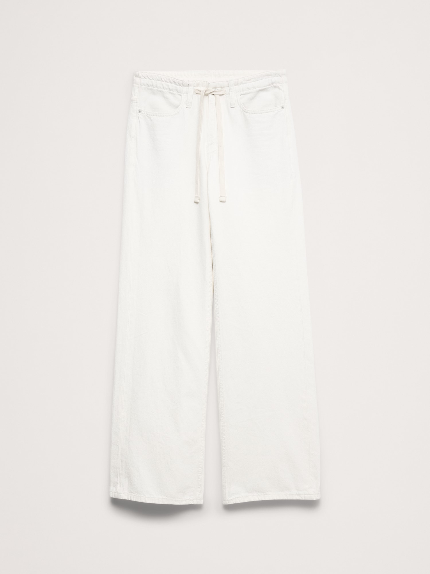 L'image numéro 5 présente Jean à jambe large et taille mi-basse avec cordon de serrage