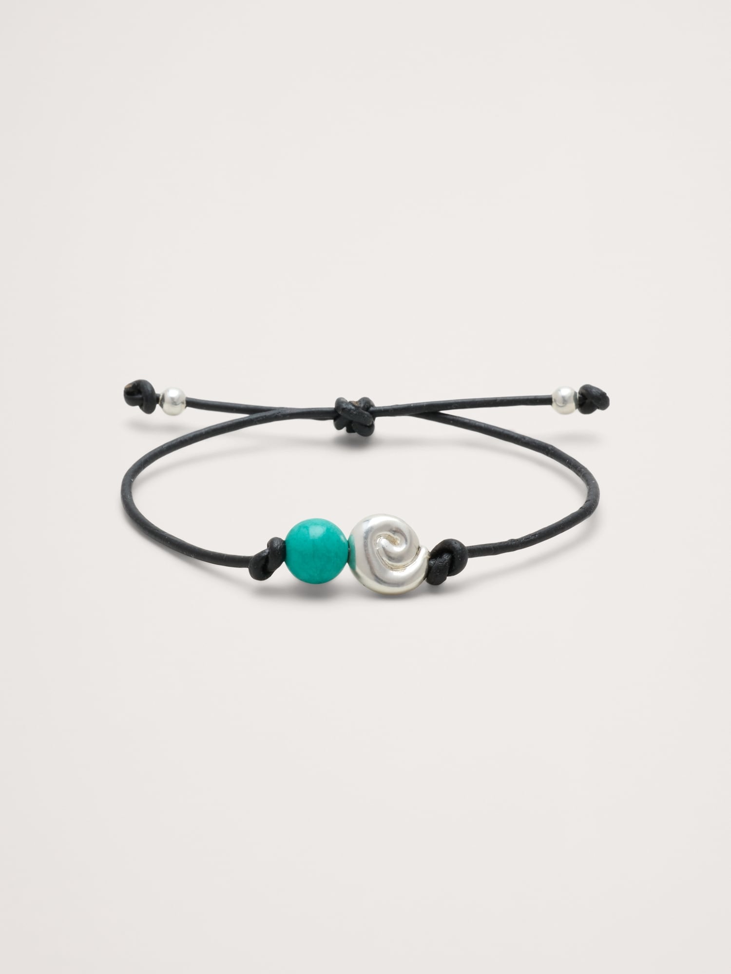 L'image numéro 1 présente Bracelet cordon avec pierres métalliques